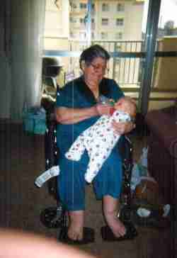 Great Grandma feeding the baby