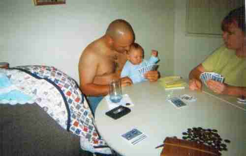 baby playing gin with daddy